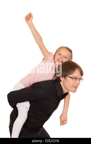 Father giving piggyback ride to his daughter which raises her hand to the sky. Isolated on white background. Stock Photo