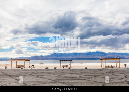 Picnic areas with overhead shelter from the sun and picnic benches at the Salton Sea Recreational Area located in California. Stock Photo