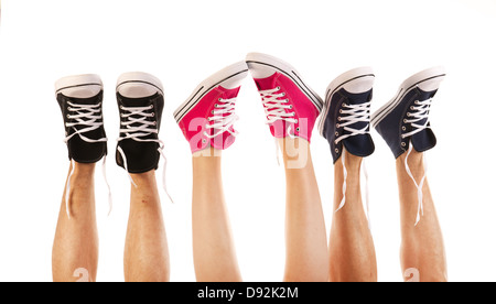 Feet in basketball shoes isolated over white background Stock Photo