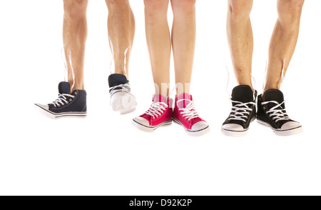 Feet in basketball shoes isolated over white background Stock Photo