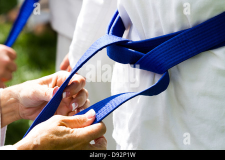 Tae Kwon Do student practicing in the park. Stock Photo