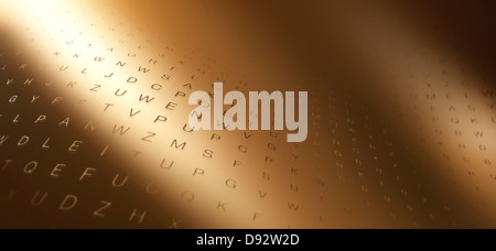 Multiple rows of random letters on a curving gold surface Stock Photo