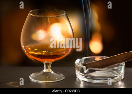 Brandy glass and cigar Stock Photo