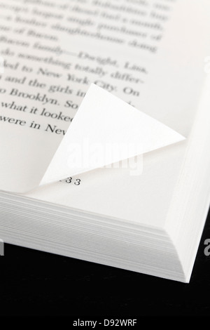A book page with a corner folded down Stock Photo