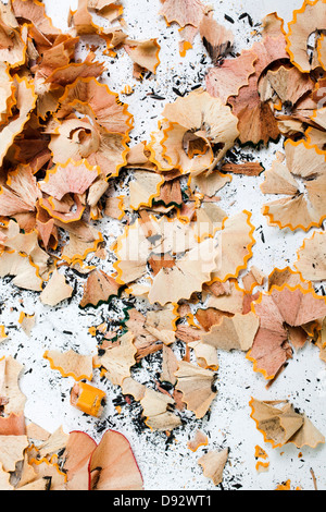 An abundance of pencil shavings and lead on a white background Stock Photo