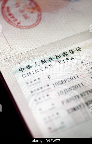 A passport with a Chinese visa in it, close-up Stock Photo