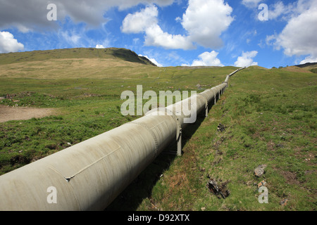 Over land pipes in Glen Lochay which are part of the Hydro-electric power scheme from the area Stock Photo