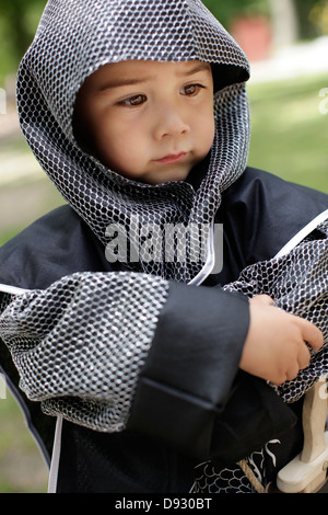 Boy wearing coat of mail Stock Photo