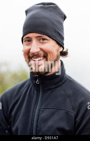 Portrait of smiling mid adult man Stock Photo