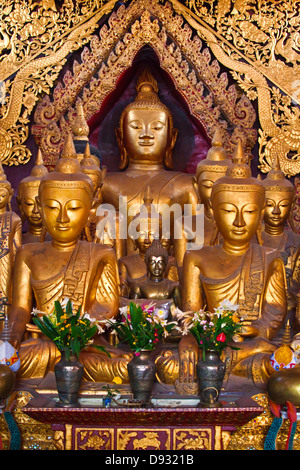 Ancient wooden BUDDHA STATUES in the main chapel of WAT JONG KHAM - KENGTUNG also known as KYAINGTONG, MYANMAR Stock Photo