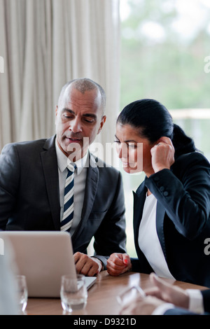 Business man and business woman using laptop Stock Photo