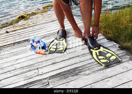 Woman wearing diving flippers Stock Photo
