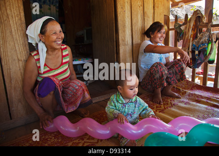 Three generations share a house in a SHAN VILLAGE near KENGTUNG also known as KYAINGTONG - MYANMAR Stock Photo