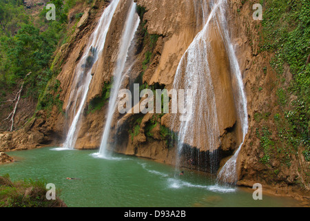 ANISAKAN FALLS drops into a green pool a few miles outside of PYIN U LWIN also known as MAYMYO - MYANMAR Stock Photo