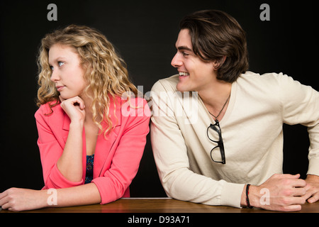 Man talking to uninterested woman Stock Photo