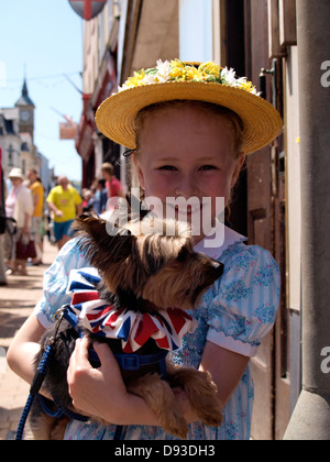 Young girl with her dog, Ilfracombe Victorian Celebration Parade, Devon, UK 2013 Stock Photo