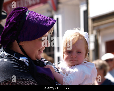 Woman with a baby, Ilfracombe Victorian Celebration Parade, Devon, UK 2013 Stock Photo