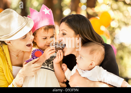 Hispanic family sharing cupcake Stock Photo