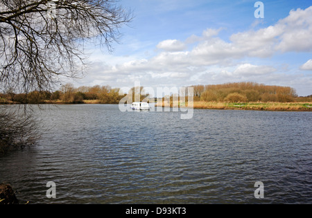 A cruiser on the River Yare on the Norfolk Broads at Surlingham, Norfolk, England, United Kingdom. Stock Photo