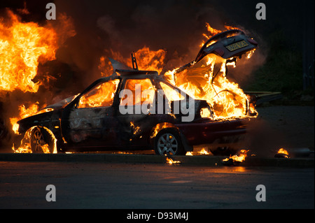 Car on Fire Blazing Flames Arson Stock Photo