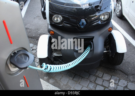 renault twizy electric car being charged at a charging station in rome italy Stock Photo