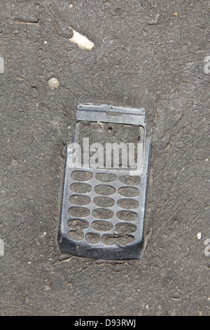 item embedded in hot tarmac road surface in sun Stock Photo