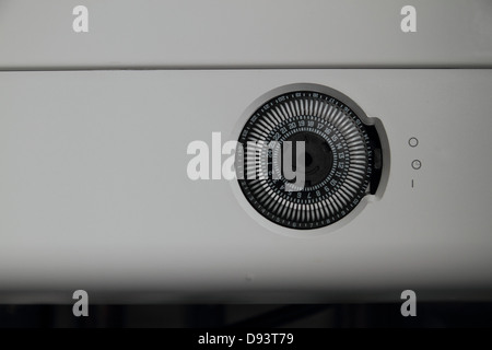 Combi Condensing Gas Boiler, with analogue timer dial. Exposed copper piping. Stock Photo