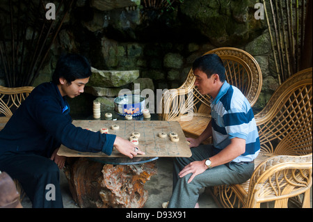 Sapa, Vietnam - Two men playing Chinese chess Stock Photo