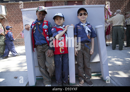 Three friends and Cub Scouts ready to march at the Memorial Day Parade in Bay Ridge, Brooklyn, NY. Stock Photo