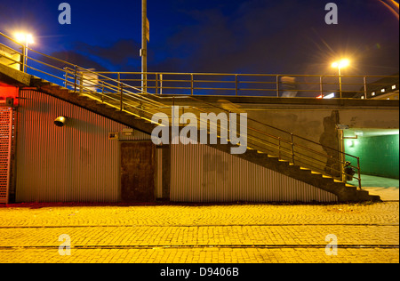 Illuminated stairs near tramway in city Stock Photo