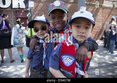 Three friends and Cub Scouts ready to march at the Memorial Day Parade in Bay Ridge, Brooklyn, NY. Stock Photo