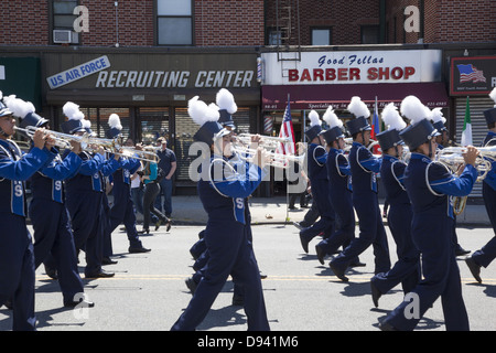 High school marching band pass a local military recruitment office during the Memorial Day Parade in Bay Ridge, Brooklyn, NY. Stock Photo