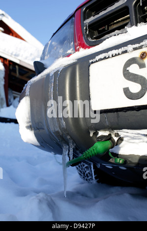 Icicle hanging from bumper, close-up Stock Photo