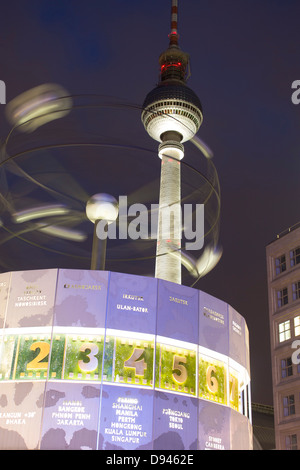 Fernsehturm TV Tower and Welt Uhr World Clock at twilight / dusk / night Alexanderplatz Mitte Berlin Germany Stock Photo