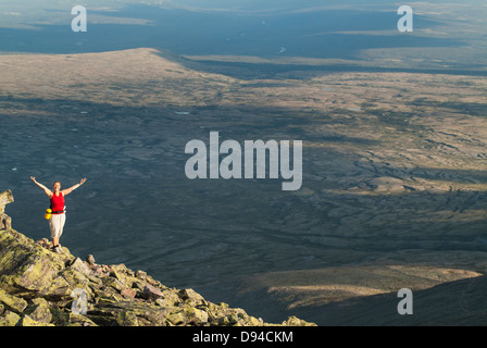 Hiker on top of mountain Stock Photo