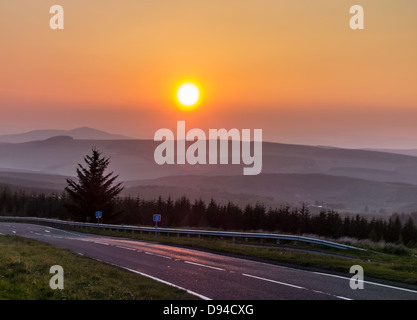 Sunsrt over the Scottish Borders from the A68, at Carter Bar, border with England. Stock Photo