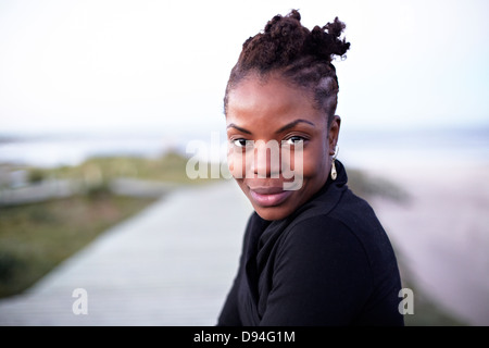 Black woman smiling outdoors Stock Photo