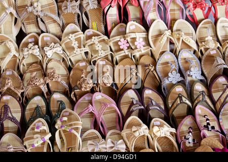 Hand made woven flip flops for sale on a stall in Mandalay Stock Photo