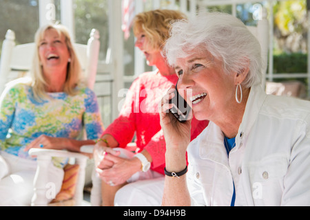Caucasian woman talking on cell phone Stock Photo