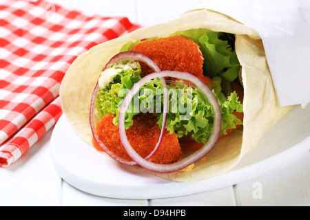 Tortilla wrap with pieces of fried cheese Stock Photo