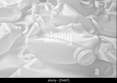 recyclable plastic milk containers need to recycle due to limited energy oil supplies become rubbish landfill semi-crystalline Stock Photo
