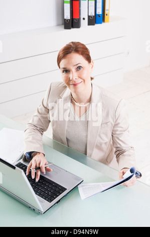 Mature Businesswomen Working in Office Stock Photo