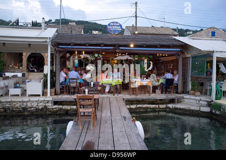 A waterfront taverna in the town of Agios Stefanos on the Northeast coast of the island of Corfu, Greece Stock Photo