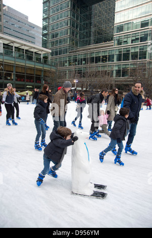 Skaters on the Canary Wharf Ice Rink. Canary Wharf, London, UK Stock Photo