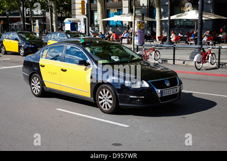 black and yellow taxi cab in barcelona city centre catalonia spain Stock Photo