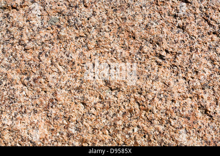natural pink granite textured surface close up Stock Photo