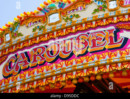 Old fashioned fun fair carousel ride Stock Photo