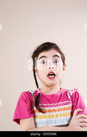 Head and Shoulders Portrait of Surprised Girl in Studio Stock Photo
