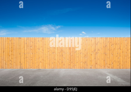 yellow fence and bue sky background Stock Photo