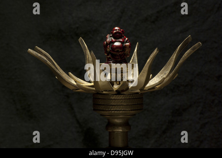 Still life with incense stick holder and figure of Buddha Stock Photo